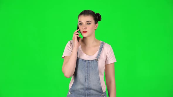 Girl Talking for Mobile Phone, Very Shocked Then Rejoice on Green Screen