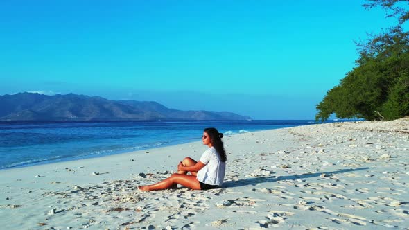 Girls happy together on paradise seashore beach wildlife by shallow sea and white sand background of