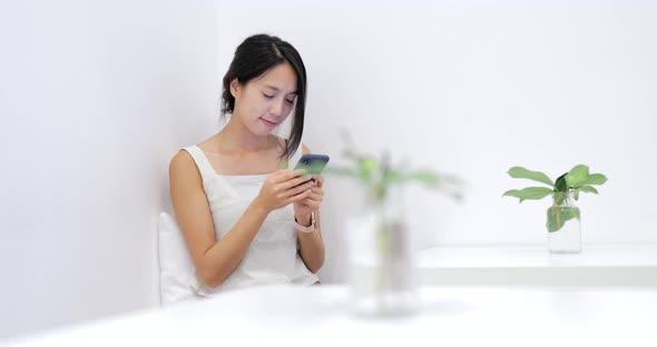 Woman use of mobile phone in restaurant 