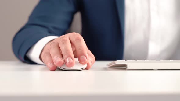 Employee using computer mouse.