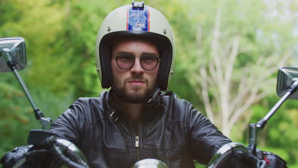 Man with helmet riding a motorcycle