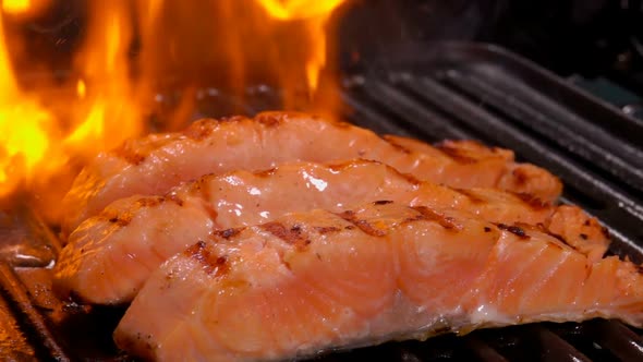 Three Pieces of Salmon Fillet Grilled on an Open Fire