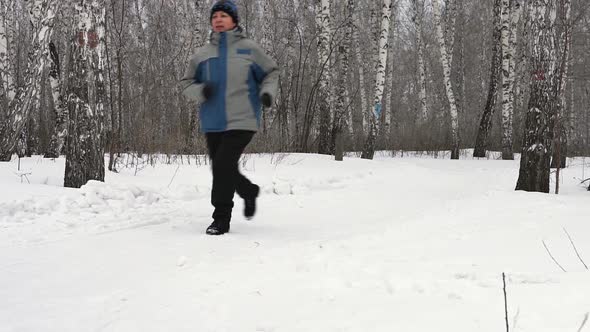 Adult Woman Is Running Through The Forest