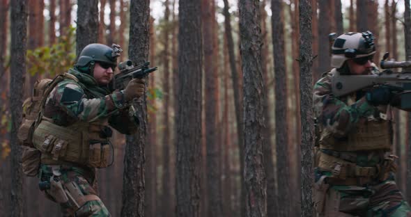 Squad of Soldiers During Military Operation Fully Equipped Camouflage on a Reconnaissance Military