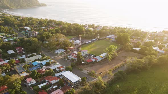 Stunning, golden sunset over the beach and seaside town of Jaco on the Pacific Coast of Costa Rica.