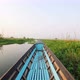 Old Blue Wooden Motor Boat Floats on the Calm River Water Surface Early Morning. Inle Lake, Myanmar - VideoHive Item for Sale