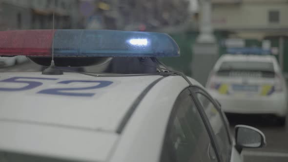 Flashing Flasher on the Roof of a Police Car. Blinker. Close-up.