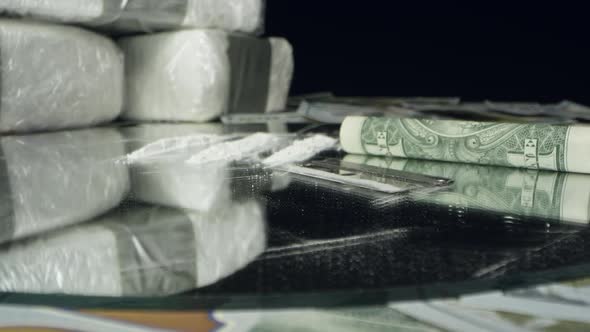 Moving over money and drugs on table top