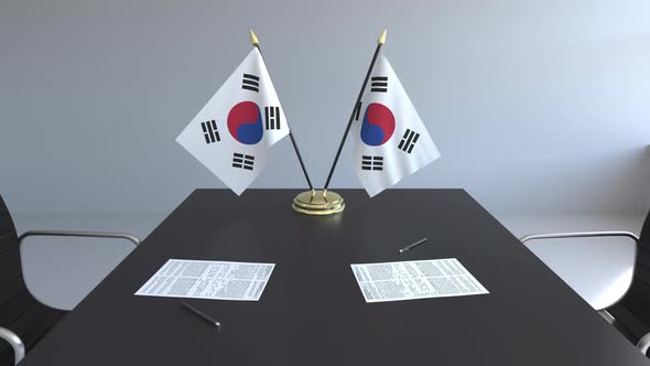 Flags of South Korea and Papers on the Table