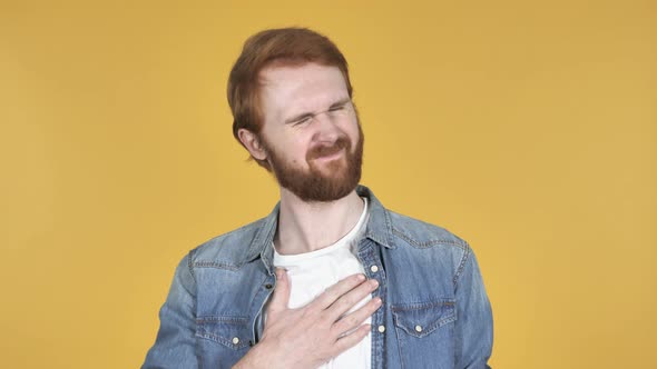 Sick Redhead Man Coughing, Yellow Background