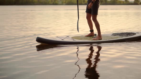 Man Sup Surfing .Stand up Paddling Surfboard. Inflatable Board For Rowing. Surfer Balance Watersport