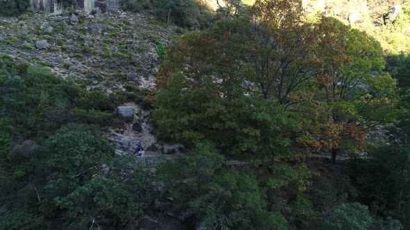 People on Viewpoint. Portuguese Cascades, Natural Pools on Steep Rocks, Arado Waterfall