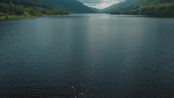 Aerial Slow Motion Tilt Up Loch Voil Scotland Dramatic Cinematic 25p