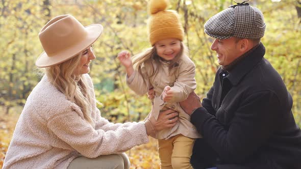 Family Have Fun in Autumn Park Nature