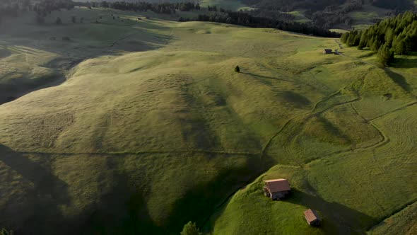 Aerial Forward Reveal Shot of Idyllic Seiser Alm Fields in Dolomites Alps Mountains Italy