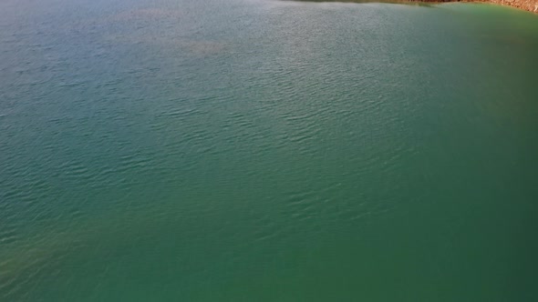 Drone View of the Turquoise Lake Formed As a Result of Mining Waste