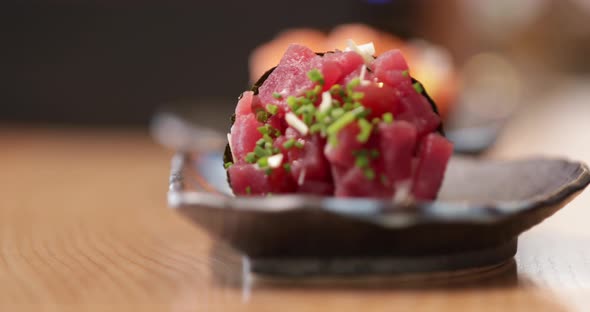 Tuna Temaki Sushi - Hand Of A Chef Placed The Sushi Cone Or Hand Roll In A Plate. - rack focus shot,