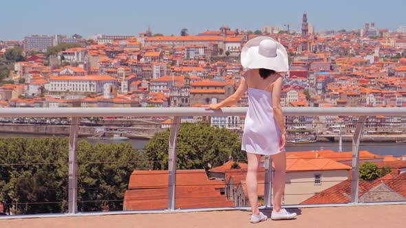 Young Tourist Enjoying Cityscape of Porto.