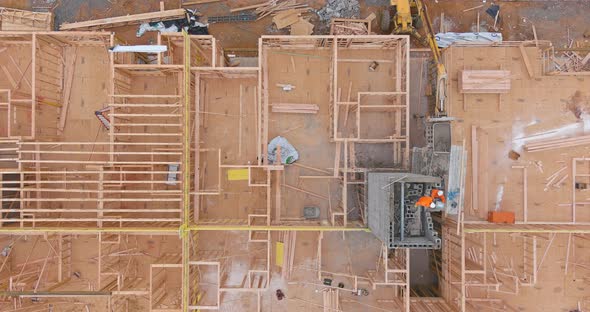 Aerial view of elevator shaft for concrete block building under construction work
