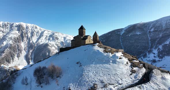 Aerial view of Gergeti Trinity Church, Tsminda Sameba in Kazbegi. Georgia 2022