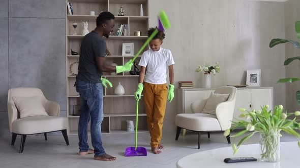 Young Dad and Son are Cleaning Room and Having Fun at Apartment During Quarantine Spbi