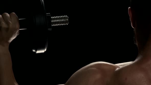 Lifting Dumbbells for Bigger Biceps Close Up.