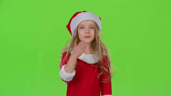 Baby Girl in Red Christmas Caps Send Air Kisses, Green Screen