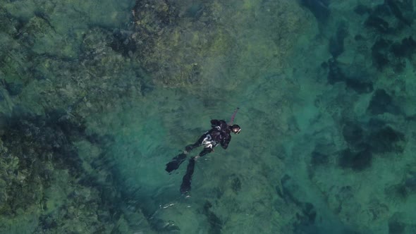 Man Swimming and Spear Fishing in the Mediterrain Sea