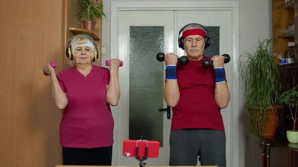 Mature Couple Man and Woman Fitness Trainer Coach Records Video Online Workout Exercises Course