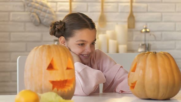 Excited Girl Looking at Jack-O-Lantern, Anticipation of Funny Fest of Halloween