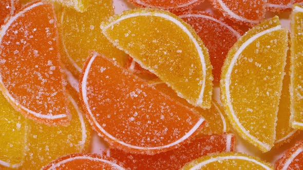 Tasty Orange Gummy Marmalade Fruit Jelly Sprinkled with Sugar Candies Rotate Slowly