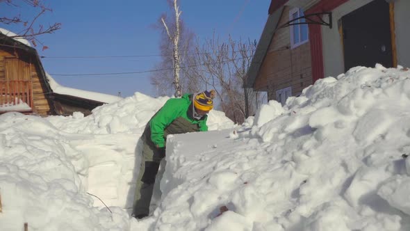 Man Shoveling Snow After Snow Storm