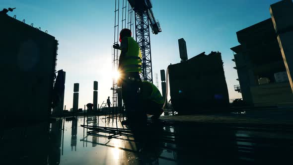 Engineers Are Making a Construction in the Building in Progress alt