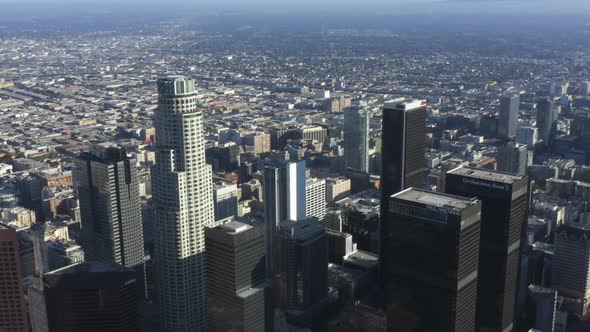 AERIAL: Wide View of Downtown Los Angeles, California Skyline at Beautiful Blue Sky and Sunny Day 