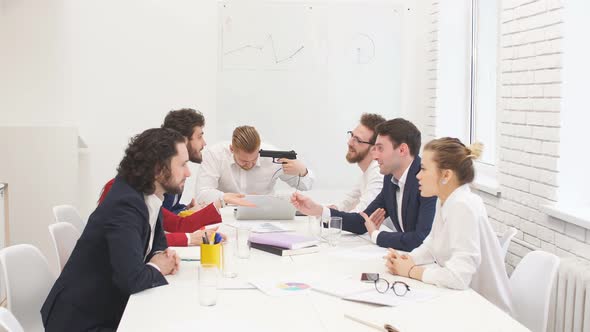 Unhappy Swearing Business People in Group Meeting in Office