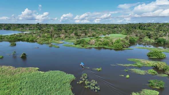 Boat sailing at Amazon River at Amazon Rainforest. Manaus Brazil.