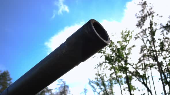 Closeup Tank Muzzle at Background of Sunny Summer Sky Outdoors