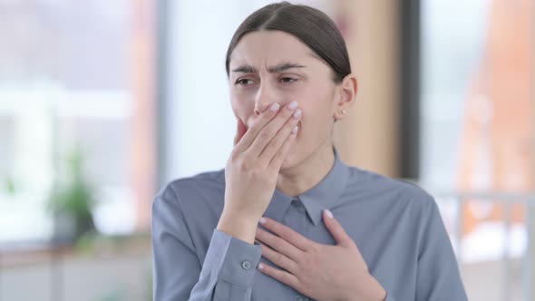 Portrait of Sick Young Latin Woman Coughing