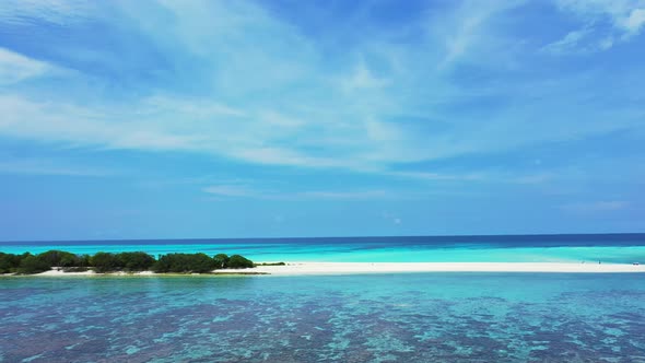 Luxury aerial island view of a white sandy paradise beach and aqua turquoise water background in col