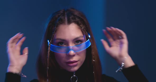 Young Woman in Stylish Blue Glasses