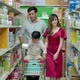 multiracial family consisting of a father Mother and son are using shopping carts in supermarket, th - VideoHive Item for Sale