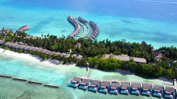 Aerial drone panorama of coastline beach voyage by blue sea and sand background