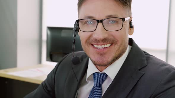 Business People Wearing Headset Working in Office