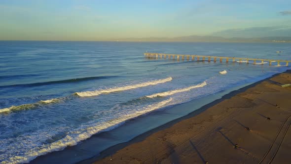 Aerial drone uav view of a volleyball court on the beach and ocean.