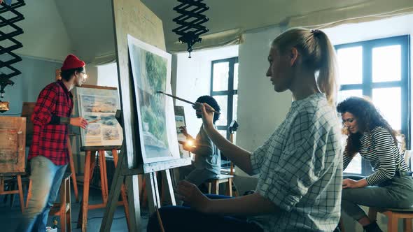 Painting Lesson Held By a Male Teacher in the Studio