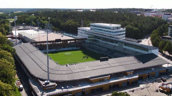 Football players training at Studenternas multi-use stadium in Uppsala, Sweden. Aerial circling