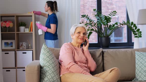 Happy Senior Woman Calling on Smartphone at Home