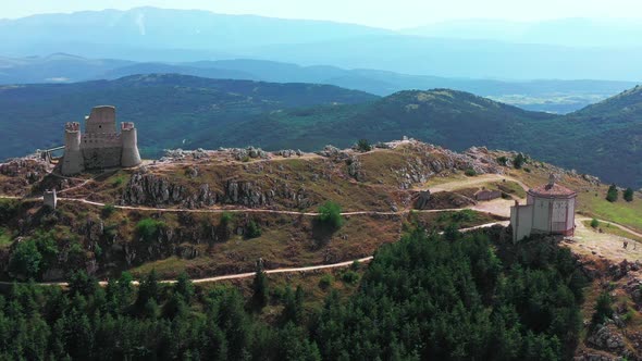 Aerial View of Ancient Castle on Mountain Hill Pine Forest on Mountain Slope