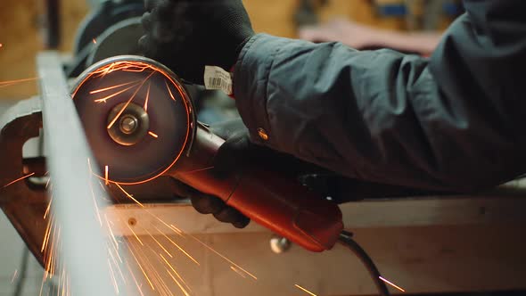 Industry Worker Grinding Metal with Angle Grinder