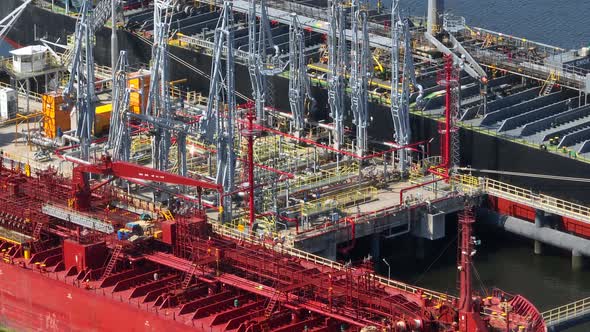 Oil Tanker Ships Unloading Petrochemicals at a Port Depot